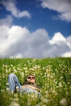 Man lying in meadow resting Stock Photos
