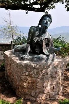 Man lying monument Stock Photos
