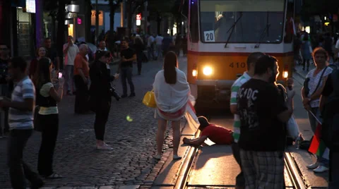 Man Lying On The Rails Blocks The Tram At The Time Of Protest March In Sofia Video stock 38917868