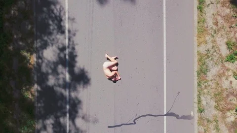 The man is lying on the road Video stock 94348522