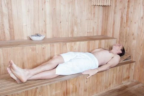 Man lying in sauna 写真素材