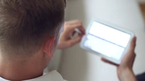 Man lying on sofa and using tablet video Stock-Footage 41788684