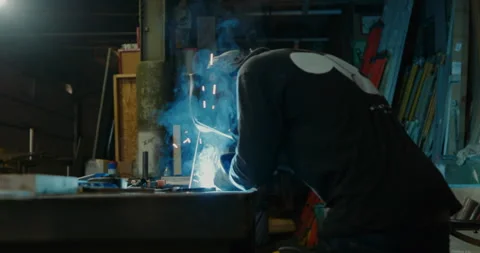 Man in Machine Shop Welding - Clip 002 Stock Footage 163941710