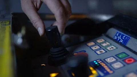 Man in a machining pulling up some levers Video stock 75444817