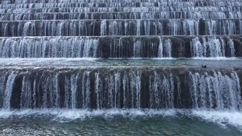 Man made beautiful large waterfall with many stairs. Video stock 232414872