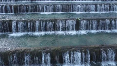 Man made beautiful large waterfall with many stairs. Stock Footage 234979955