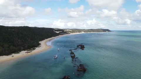Man-made harbour using a cluster of scuttled ships to provide safe Stock Footage 209512303