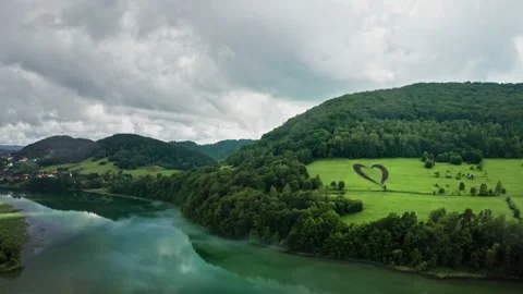 Man-made heart shape on green uphill. Love sign for planet Earth. Stock-Footage 133612941