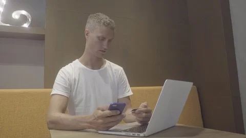 Man made payment using credit card and smartphone Stock Footage 88593319