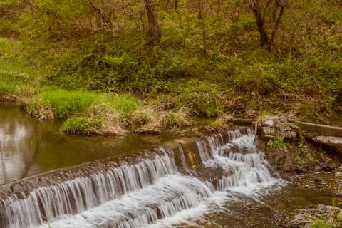 Man made waterfall in river. Stock Photos