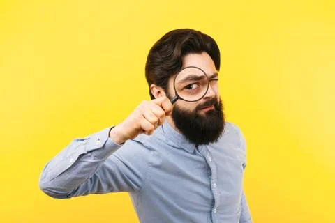 Man with magnifier Stock Photos