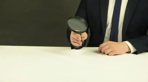 A Man with a Magnifying Glass Stock Footage 62332226