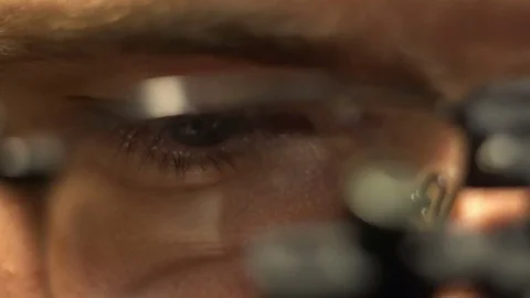 Man in the magnifying glasses. Close-up of eye Stock Footage 72203396