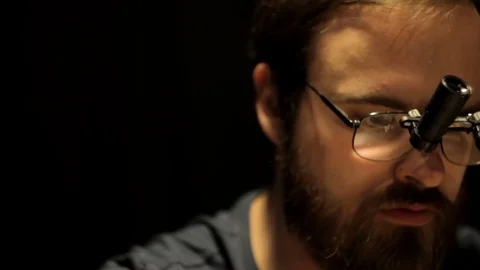 Man in the magnifying glasses close-up Stock Footage 72203357