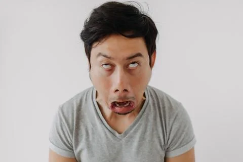 Man make funny teasing face for humor isolated on white. Foto stock