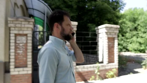 A man makes an appointment by phone Stock Footage 157977954