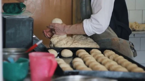 Man makes bread by hand Stock Footage 74371350
