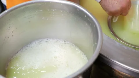 Man makes cheese, brews milk, pours whey, production process, individual Video stock 210148834