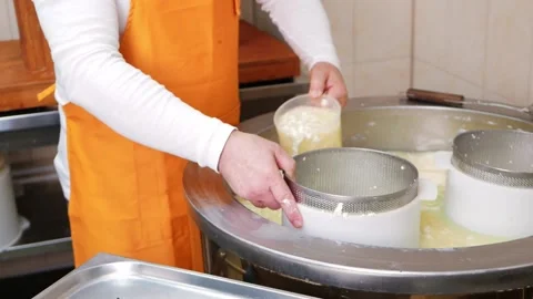 Man makes cheese, curd mass, fermentation of milk, process of producing homemade Stock Footage 210148983