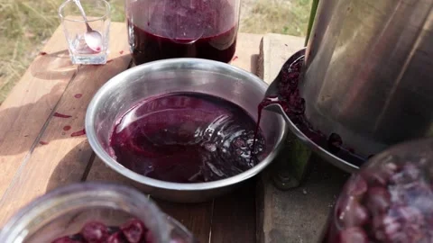 A man makes cherry juice Stock Footage 326901651