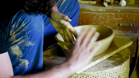 A man makes a clay pot Stock Footage 168949212
