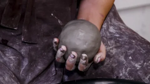 Man makes a clay pot or vase on a potter's wheel Video stock 339912663