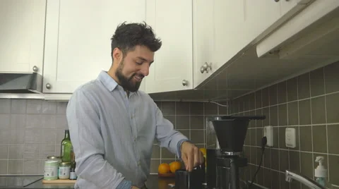 Man makes coffee and use smartphone Stock Footage 51332834