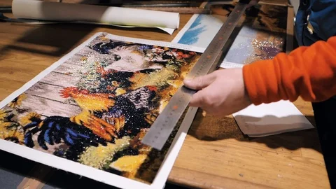 А man makes diamond embroidery 库存影片 101952884