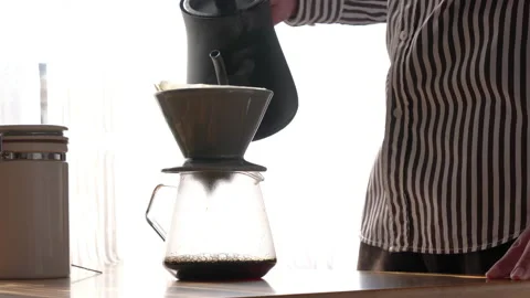 A man makes drip coffee. Video stock 169262811