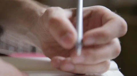 Man makes entries in Notepad. Close up Stock Footage 64904000
