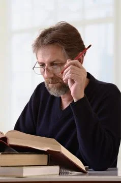 Man makes an entry in the notebook Stock Photos