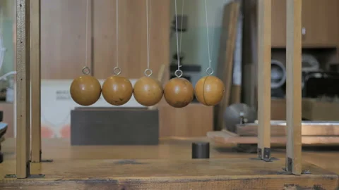 Man Makes An Experiment With Newton's Pendulum. Stock Footage 137939142