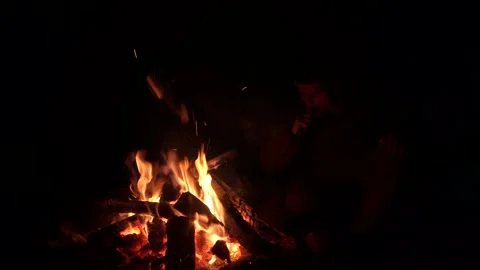 A man makes a fire, campfire, night fire Stock Footage 272158689