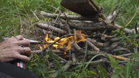 Man makes a fire in the forest nature Stock Footage 108501395