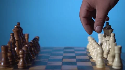 Man makes the first move in chess alone Stock Footage 133232004