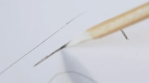 Man makes hatching on paper Stock Footage 124209197