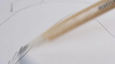 Man makes hatching on paper Stock Footage 124209880