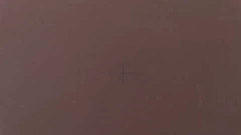 Man makes hole with an awl on a sheet of a brown chipboard. Macro. Close-up. Woo Stock Footage 116647748