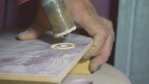 Man makes a hole in the tile. Stock Footage 97078332