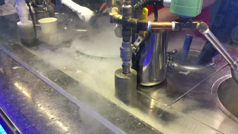Man makes ice cream with liquid nitrogen Stock Footage 308424260