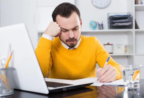 Man makes important documents Stock Photos