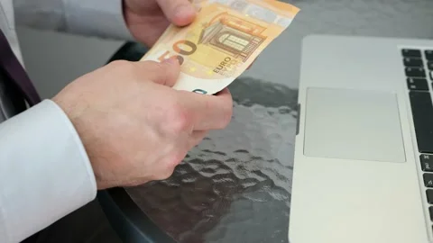 A man makes money on the Internet, working with laptops. 스톡 동영상 141676325