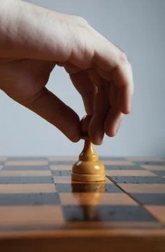Man makes a move chess pawn 写真素材