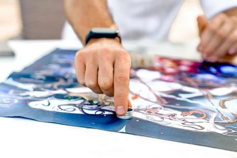 Man Makes Move with Game Chip in Form of Ring After Rolling Dice, Close-Up of Stock Photos