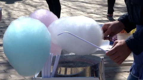 The man makes multicolored sugar wool Stock Footage 95308093