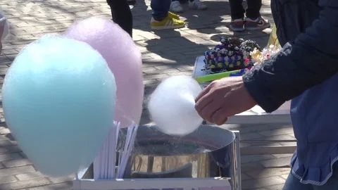 The man makes multicolored sugar wool Stock Footage 114436120