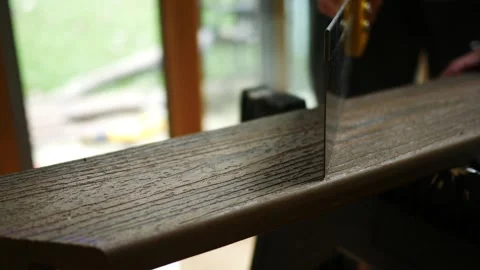 Man Makes Notch in Composite Deck Board 스톡 동영상 344826092