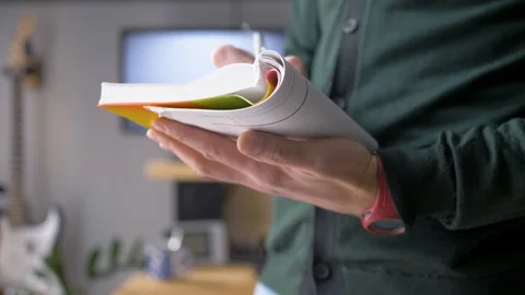 The man makes notes in a notebook and thinks about something. Video stock 129992922