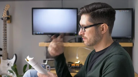 The man makes notes in a notebook and thinks about something. Stock Footage 129994923