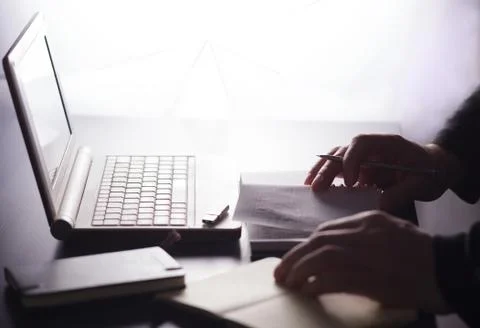 Man makes notes in a notebook. 写真素材